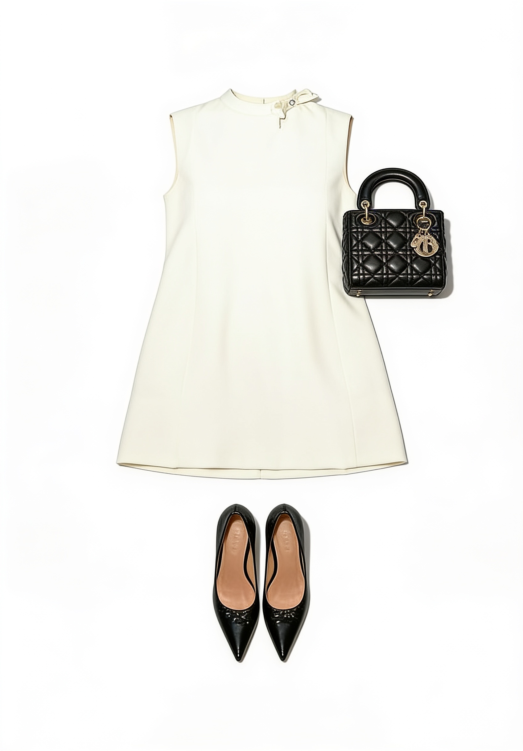 Ivory sleeveless mini dress and black pumps