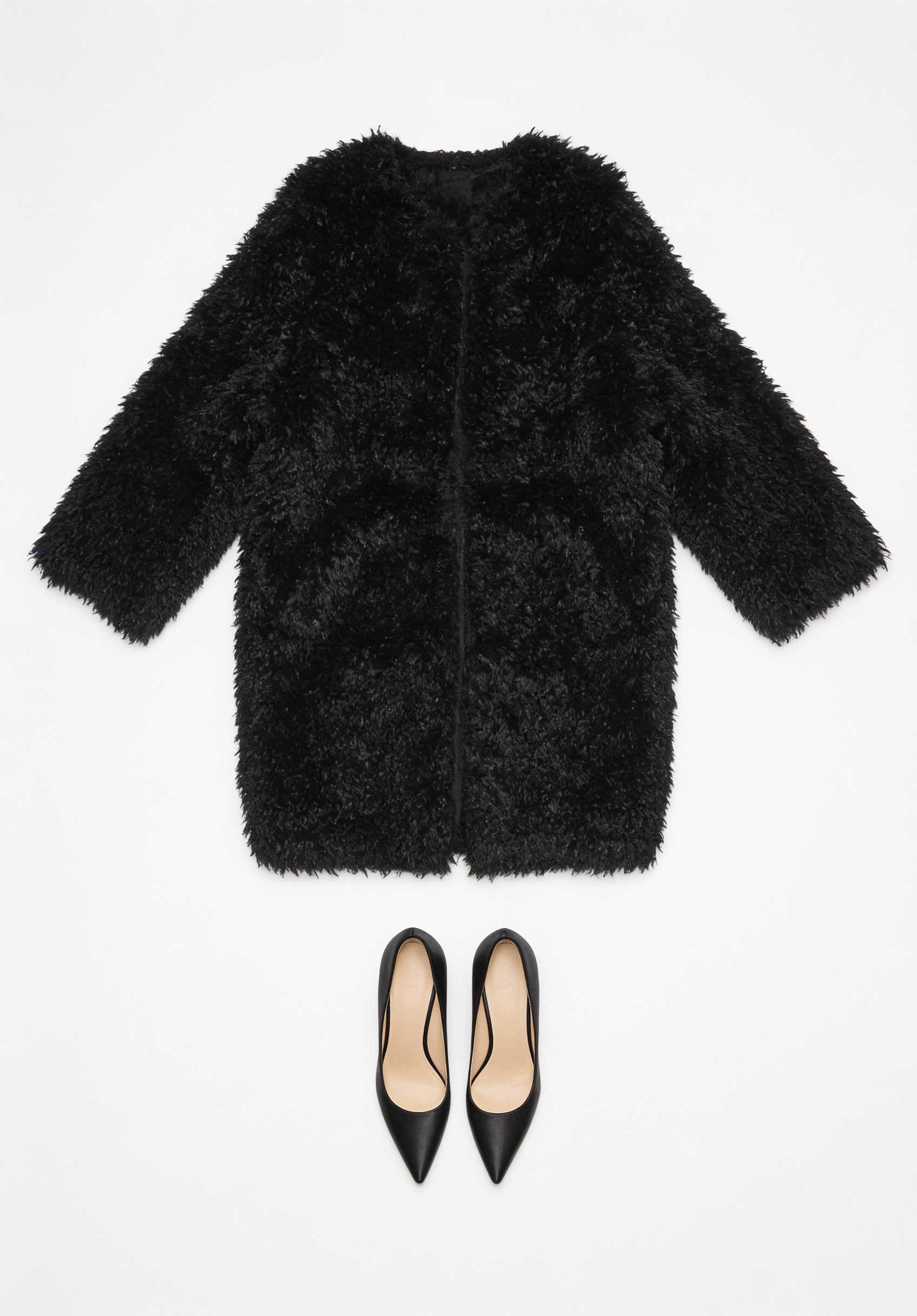 Black textured coat and pointed pumps