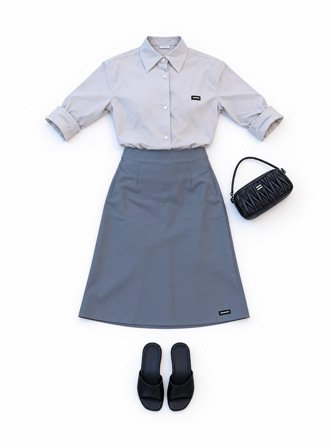 Pale blue shirt and slate A-line skirt
